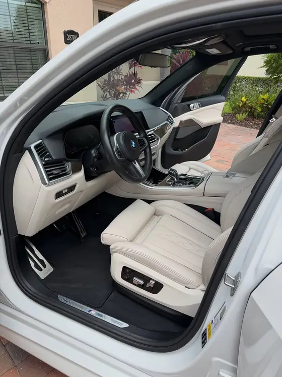 Immaculate white leather interior of a BMW X5 after interior detail
