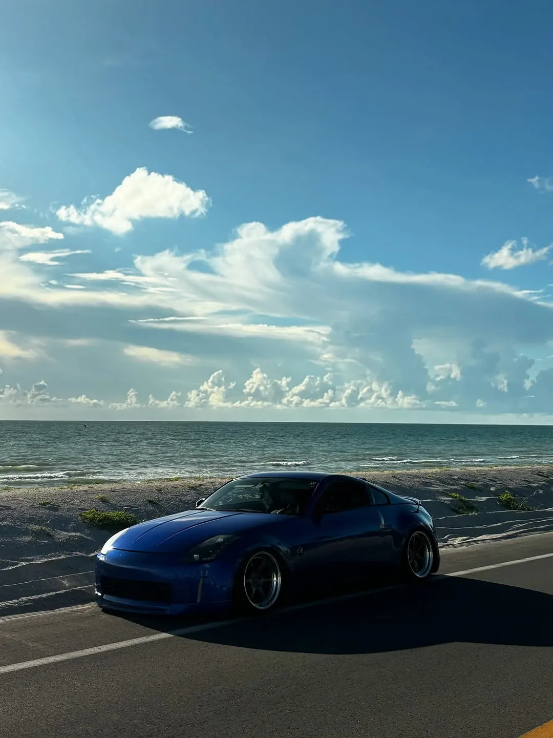 Tarek's blue Nissan 350Z parked along a SWFL beach road